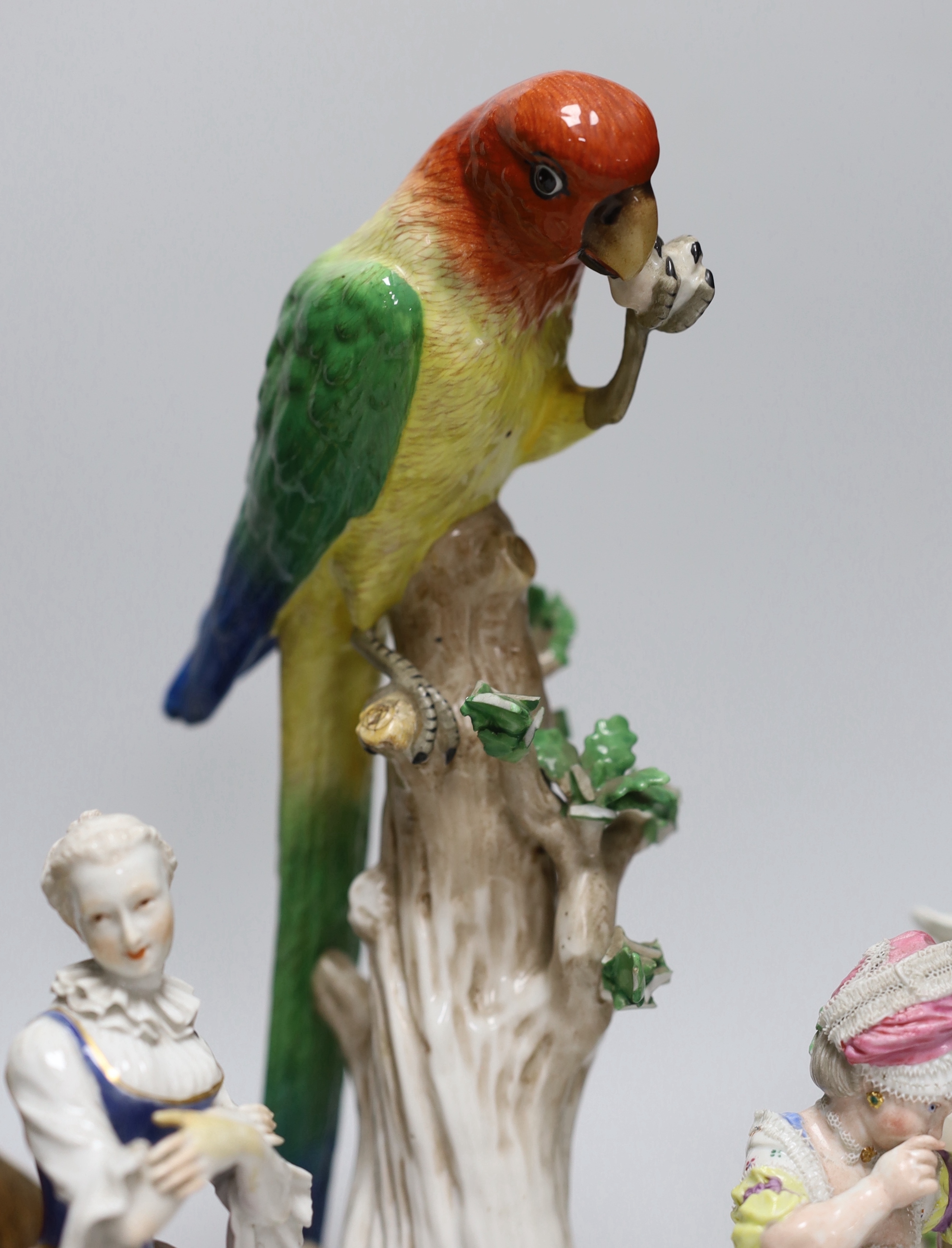 An 18th century Meissen figure group, 16cm, two 19th century Meissen figures, German cockatoo, and a Dresden asiatic pheasant